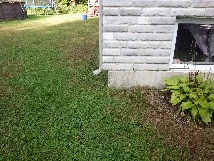 Vignette du secteur Mascouche Heights : terrain en pente près d'une fondation